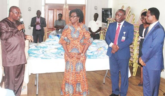 Mr Alexander Abban (left), Deputy Minister of Health, making some remarks after the presentation of the items. Also in the photograph are Rev Veronica Darko (2nd left), Chairperson, 14th Governing Council, Nursing and Midwifery Council, and Apostle Eric Nyamekye (right), Chairman, Church of Pentecost. Picture: Maxwell Ocloo