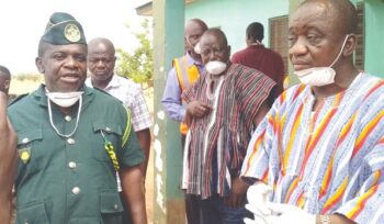 Chief Superintendent William Peter Andoh (left), the acting North East Region GIS Commander, and Mr Solomon Boar (right), North East Regional Minister