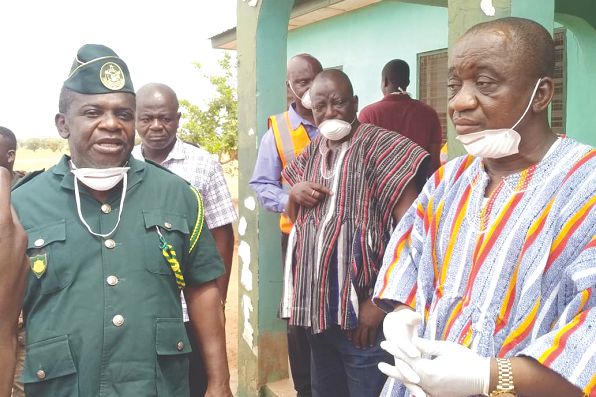 Chief Superintendent William Peter Andoh (left), the acting North East Region GIS Commander, and Mr Solomon Boar (right), North East Regional Minister